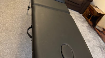 Luxurious massage couch at Powerful Aesthetics, Great Sankey, England, GB, perfect for relaxation and comfort.