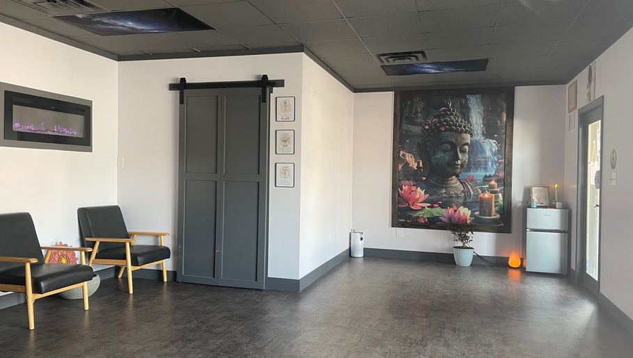 Relaxing reception area of Salt Spa II showcasing Buddha mural and seating in Newport, Tennessee, US.