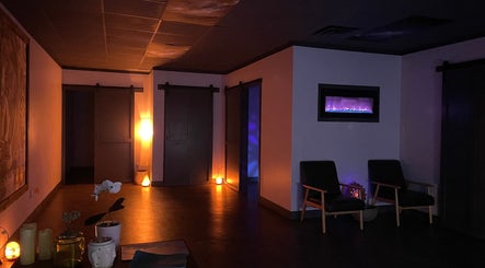 Relaxing dim-lit room at Salt Spa II, Newport, Tennessee, US, featuring cozy seating and a calming ambiance.