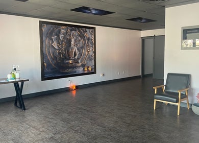 Peaceful seating area with Buddha mural at Salt Spa II, Newport, Tennessee, US. Inviting spiritual ambiance.