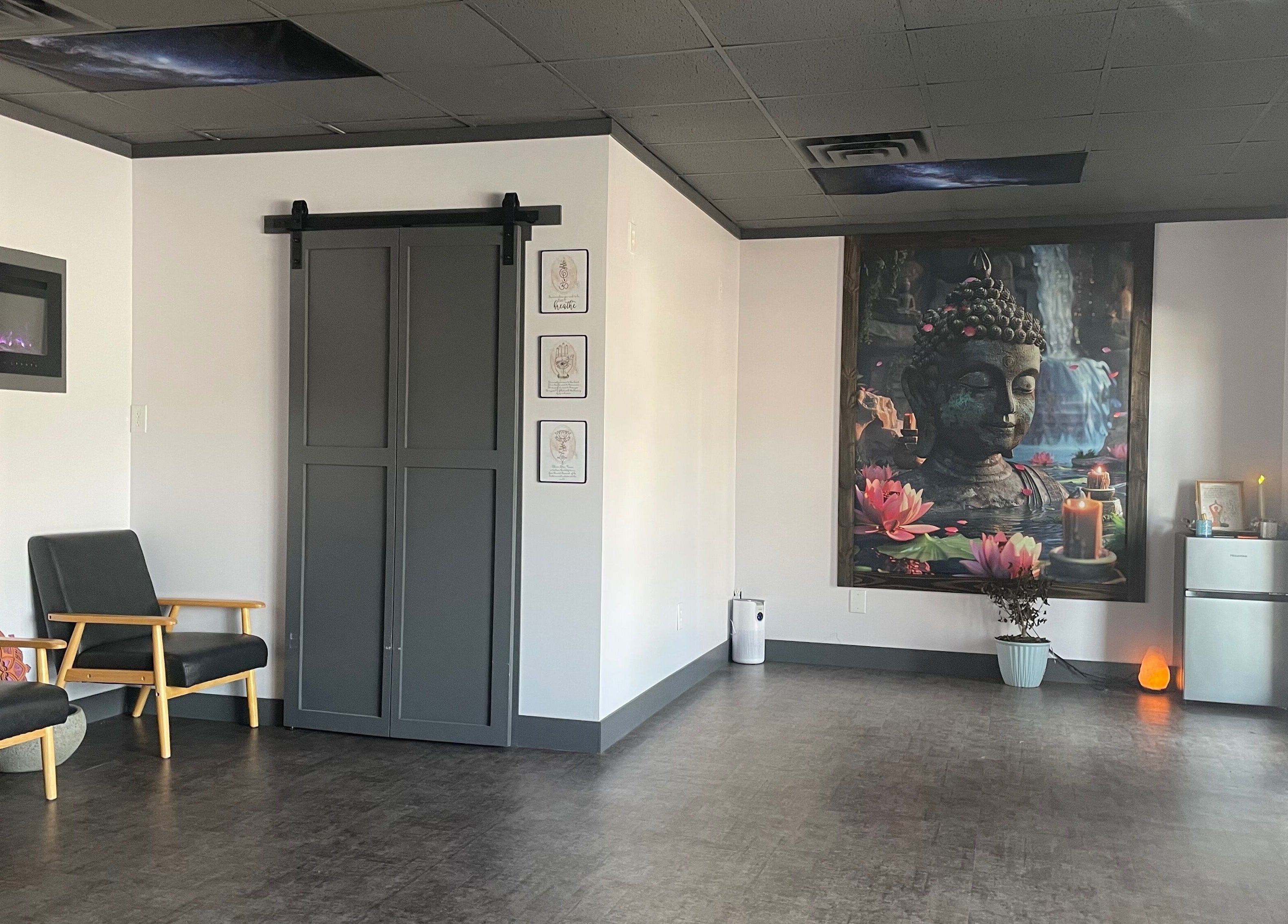 Relaxing interior of Salt Spa II in Newport, Tennessee featuring serene decor and a Buddha mural.