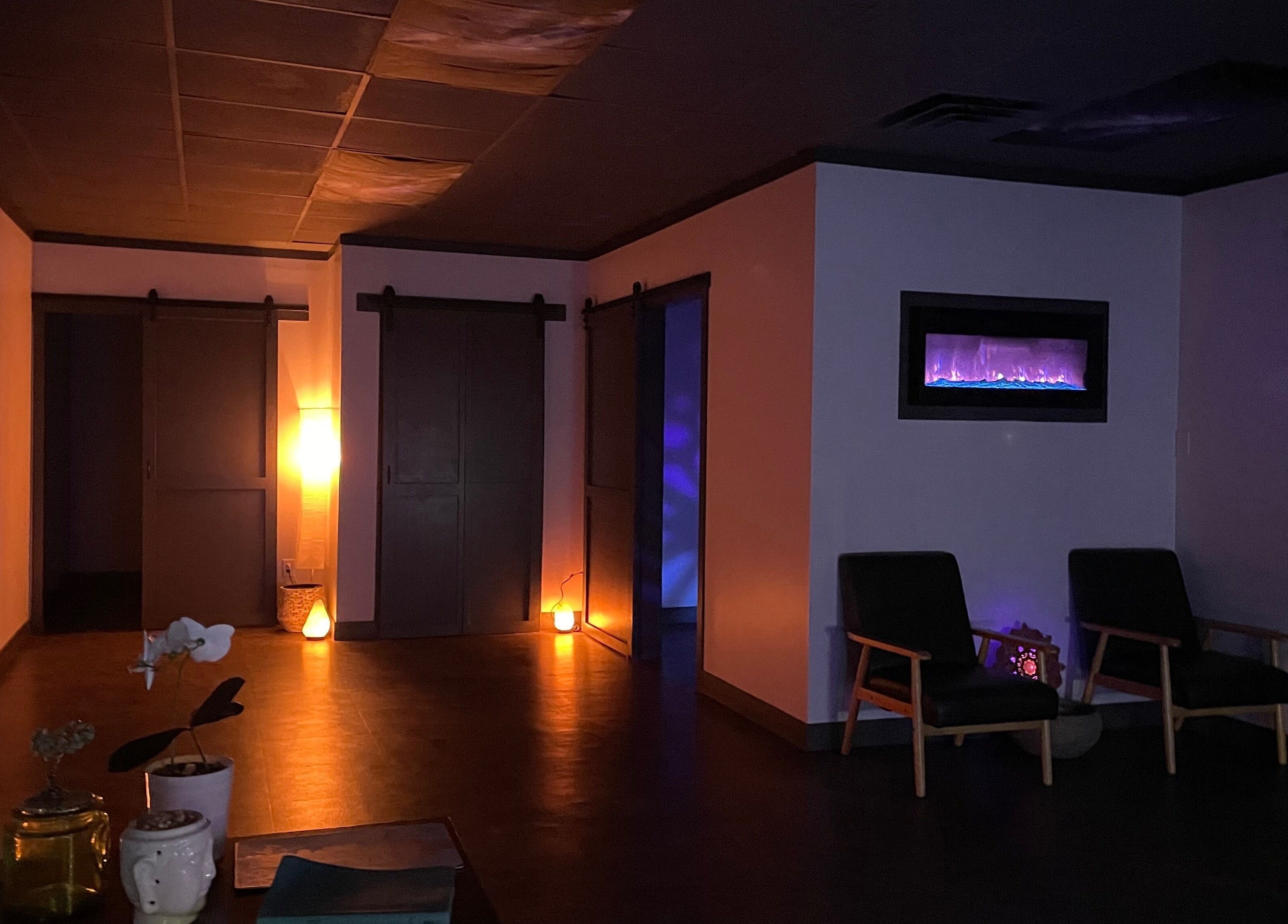 Tranquil lounge with ambient lighting at Salt Spa II, Newport, Tennessee, US, showcasing cozy seating and decor.