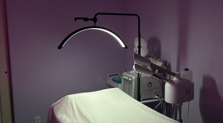 Tranquil treatment room at bn.esthetics, El Paso, Texas, US with spa bed under soothing lighting.