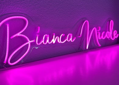 Pink neon sign at Bn.Esthetics in El Paso, Texas, US illuminates the beauty venue ambiance.