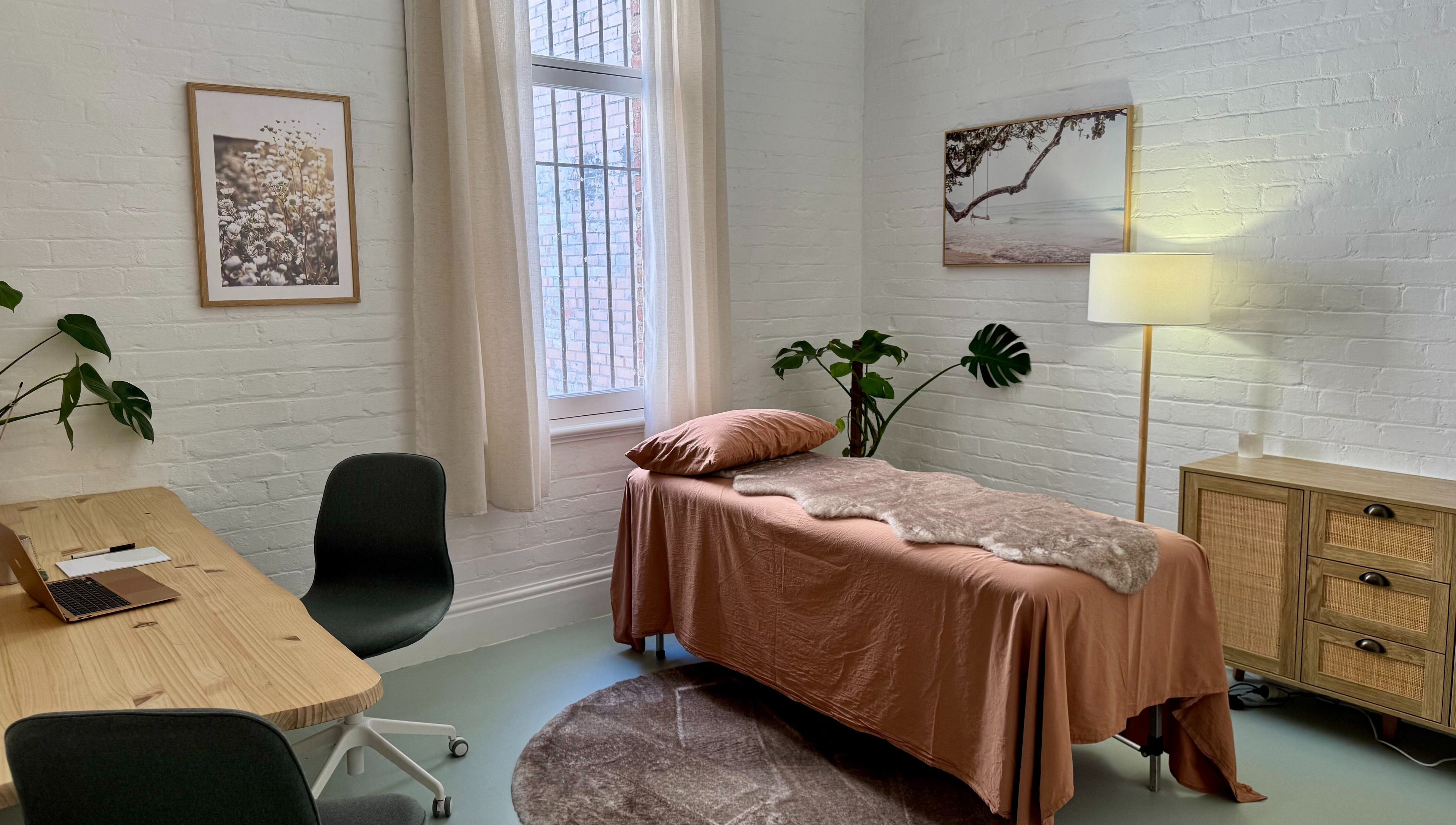Cozy treatment room at Jing By Archer - Fremantle, Fremantle, Western Australia, AU with a massage table and decor.