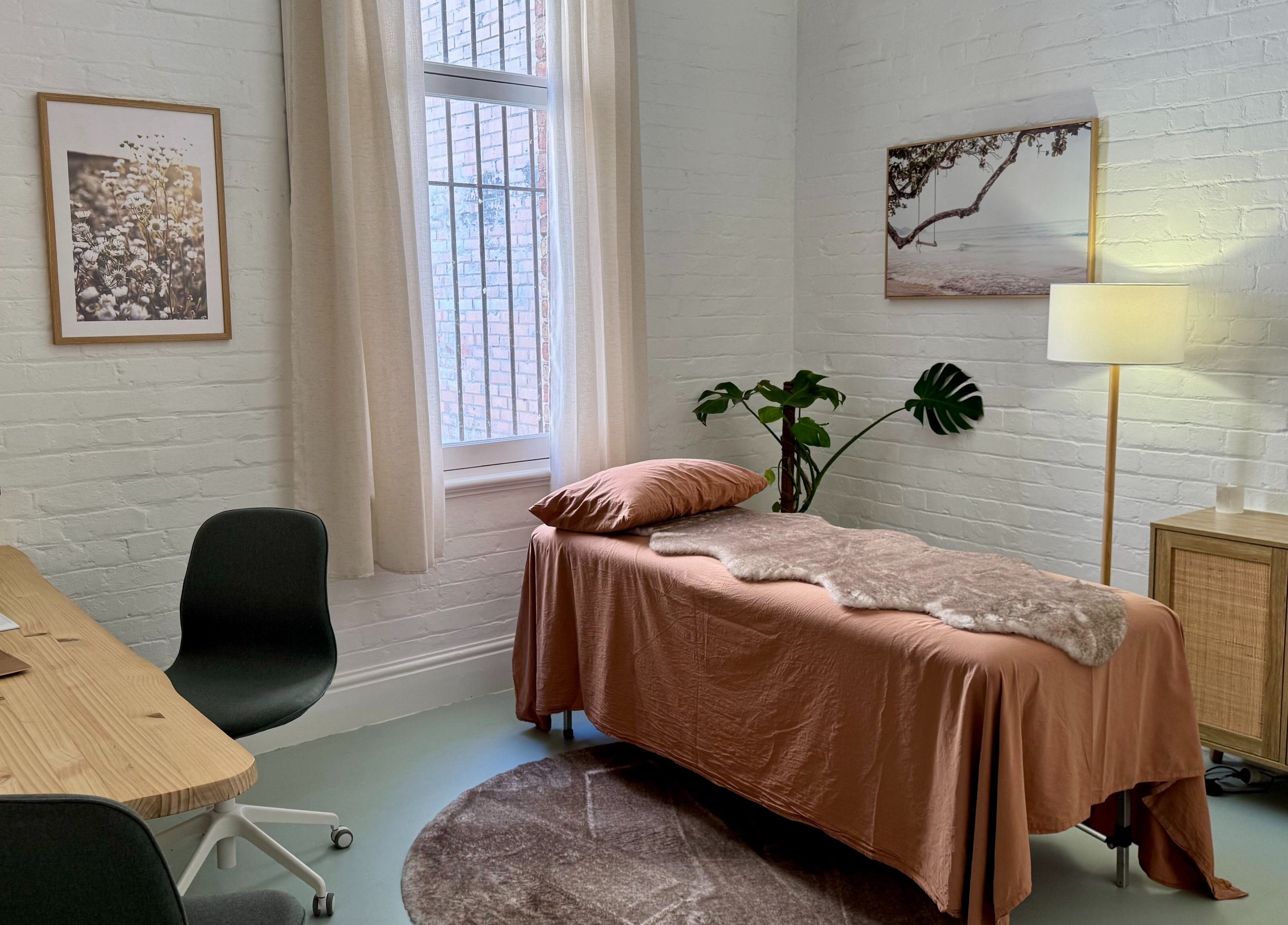 Cozy treatment room at Jing By Archer - Fremantle, Fremantle, Western Australia, AU with a massage table and decor.