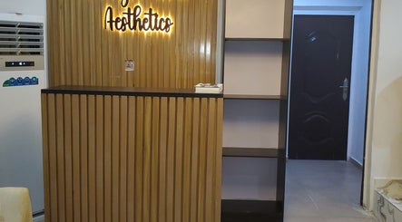 Reception area at Amethyst Aura Med Spa, Ikeja, Lagos, NG with sleek wooden decor and modern aesthetics.