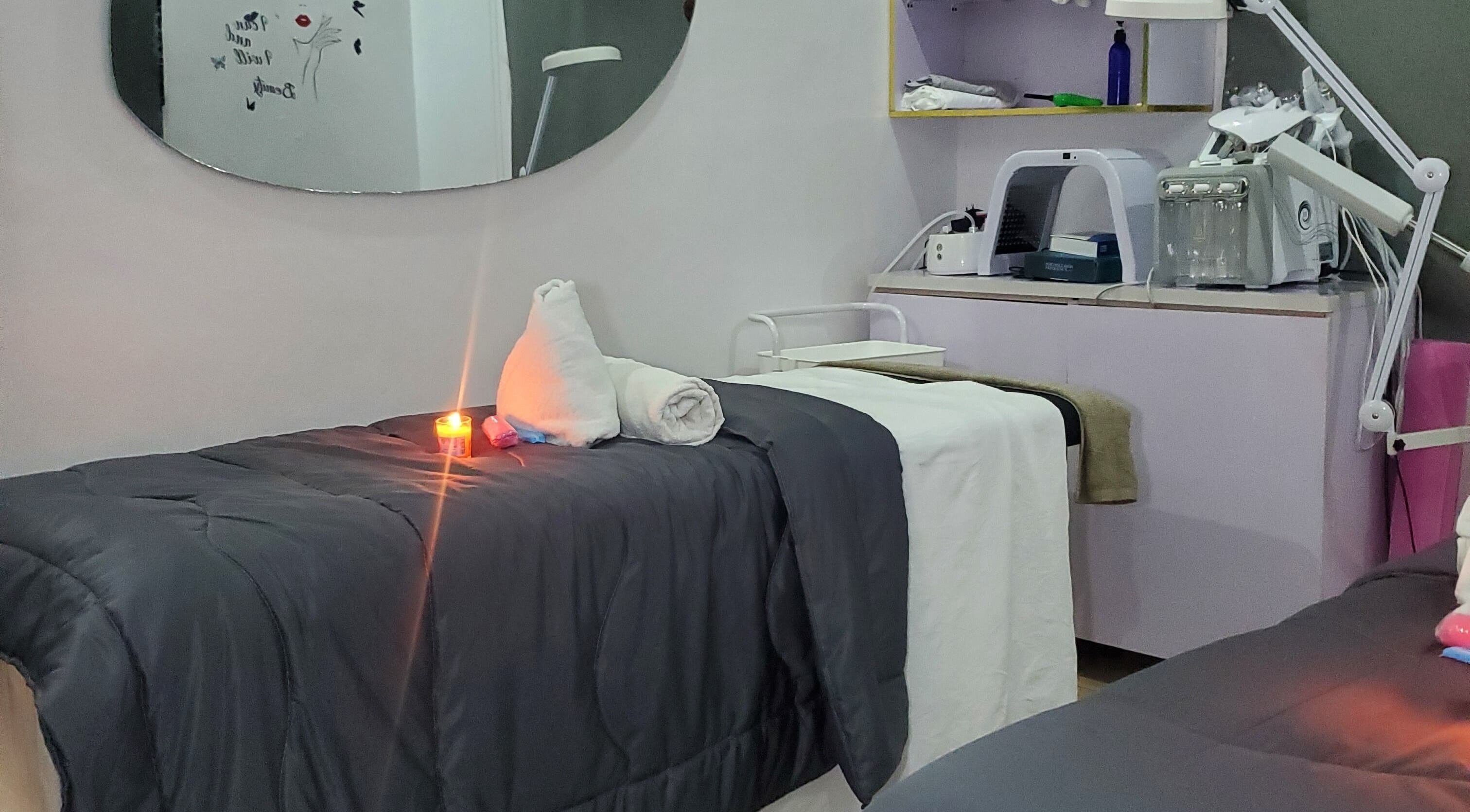 Relaxing treatment room at Amethyst Aura Aesthetics Spa, Ikeja, Lagos, NG with a candlelit ambiance.
