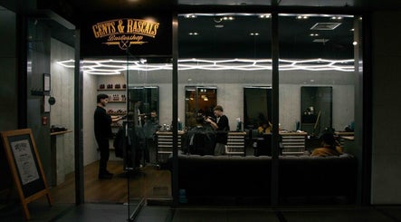 Gent & Rascals Barbershop - Britomart Store in Auckland, NZ offers a stylish and modern interior view.
