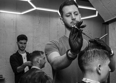Barber performing haircut at Gent & Rascals Barbershop - Britomart Store, Auckland, NZ.