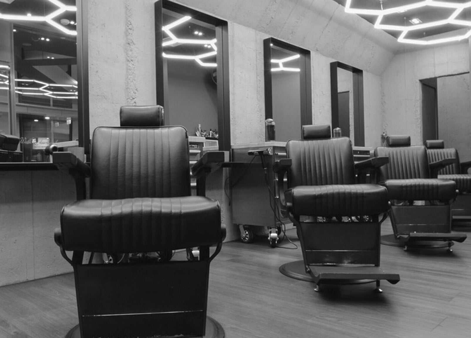 Modern interior of Gents & Rascals Barbershop - Britomart Store in Auckland, Auckland, NZ with stylish chairs.