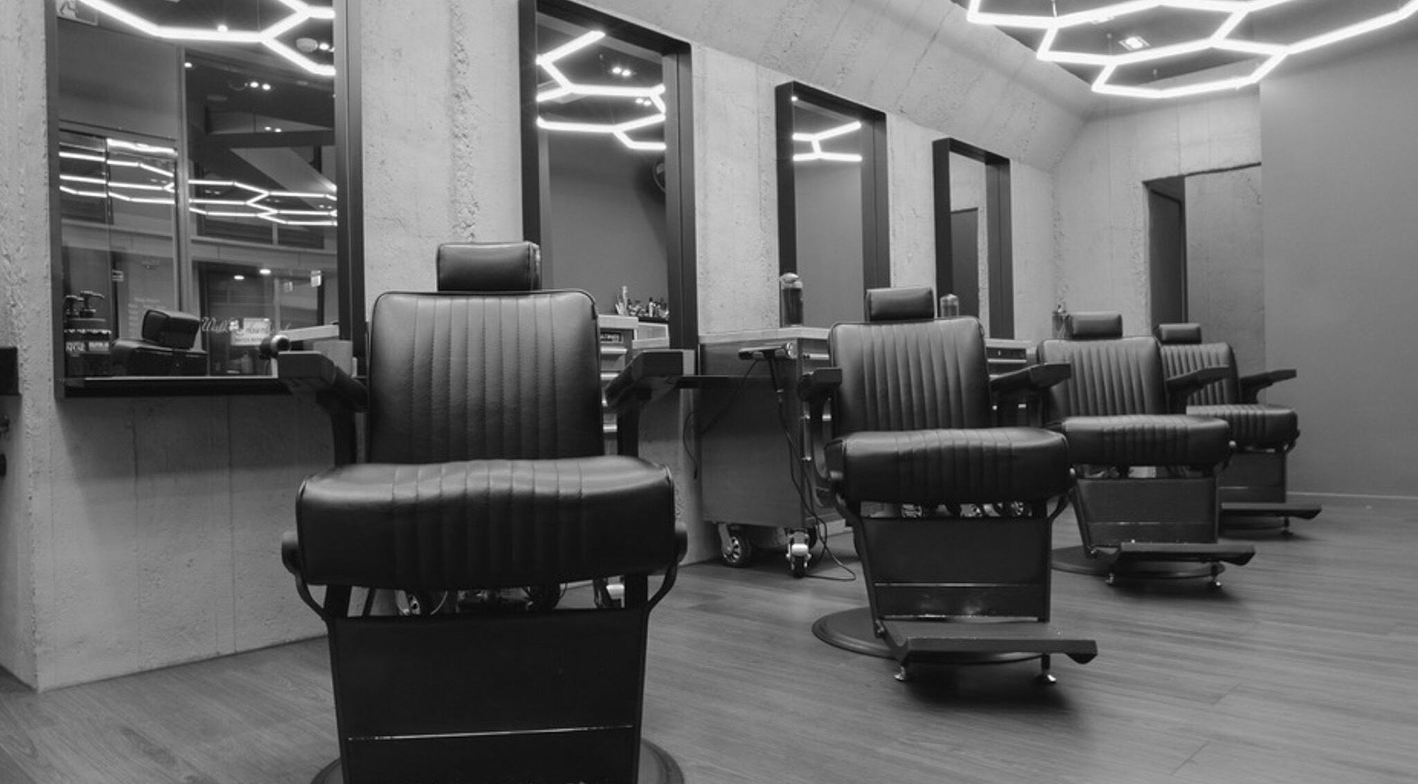 Modern interior of Gents & Rascals Barbershop - Britomart Store in Auckland, Auckland, NZ with stylish chairs.