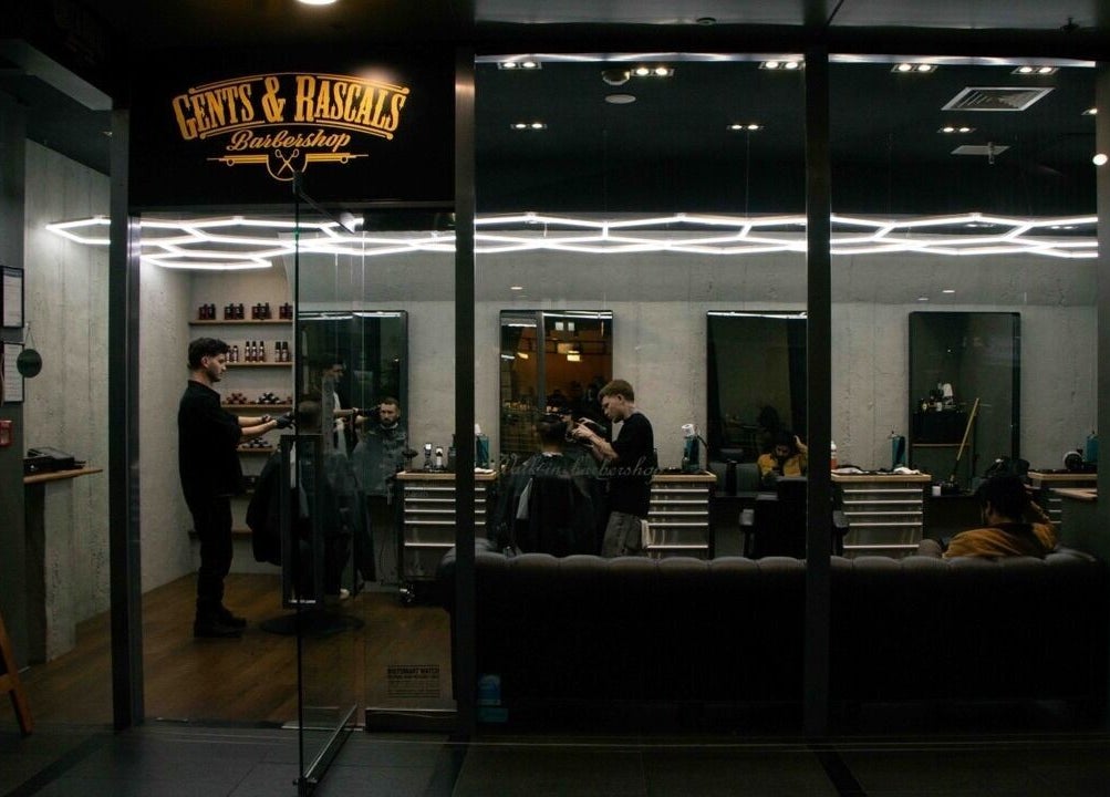 Interior of Gents & Rascals Barbershop - Britomart Store, Auckland, NZ with stylists at work.