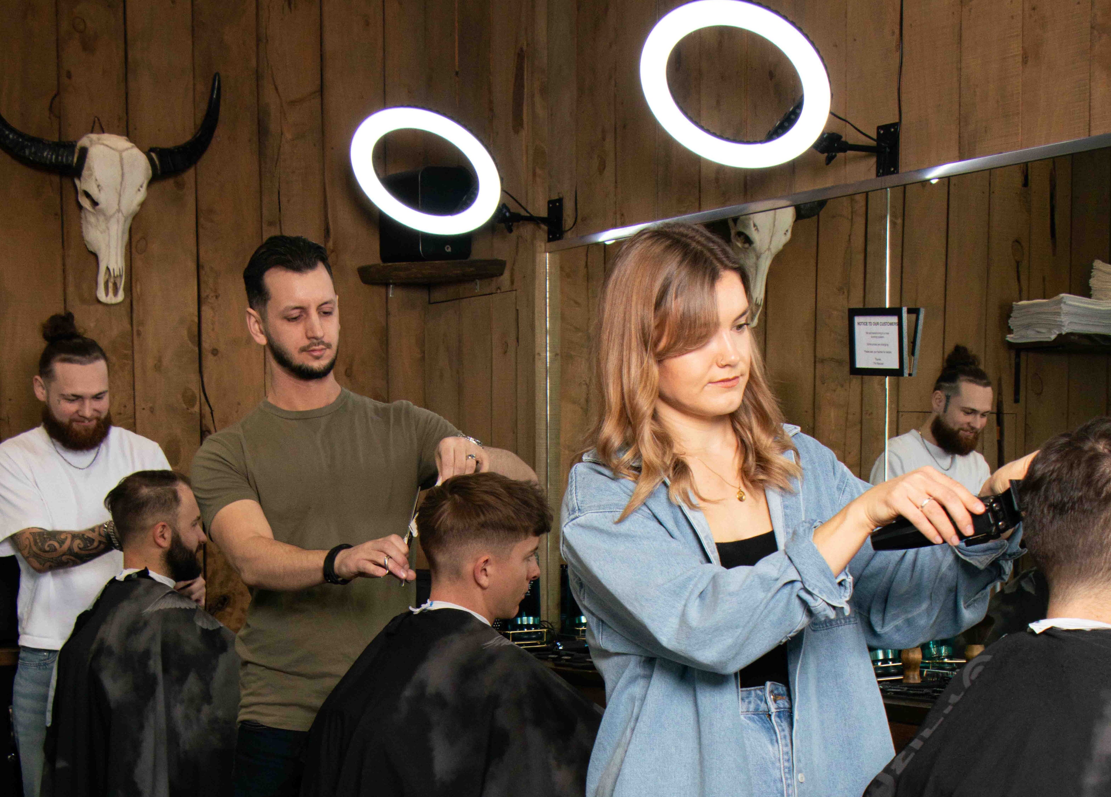 Expert barbers at Gents & Rascals barbershop, HSBC tower, Auckland, NZ providing stylish haircuts.