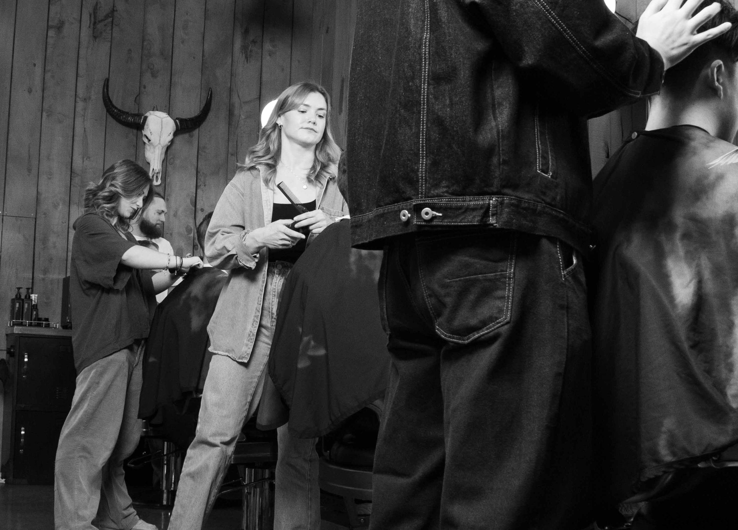 Stylish barbers at Gents & Rascals barbershop, HSBC tower, Auckland, NZ providing expert grooming.