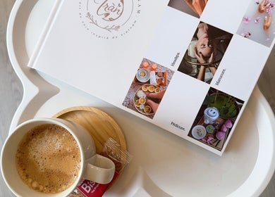 Coffee cup and beauty spa brochure at Beauté d’Annam, La Teste-de-Buch, Nouvelle-aquitaine, FR.