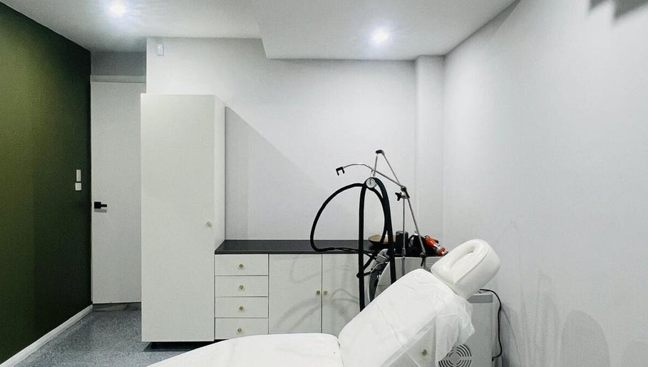 Treatment room at Summer Cosmetics Studio, Catherine Field, New South Wales, AU, with a plush white bed.