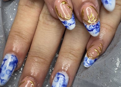 Intricate blue and gold nail art by WyldNails in Bilsthorpe, England, GB.