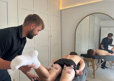 A therapist performing cupping therapy at SGM Sports Therapy Ltd, East Morton, England, GB.