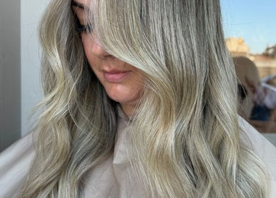 Blonde wavy hairstyle at ChloeBHair, Milngavie, Scotland, GB. Showcasing silky, modern highlights.