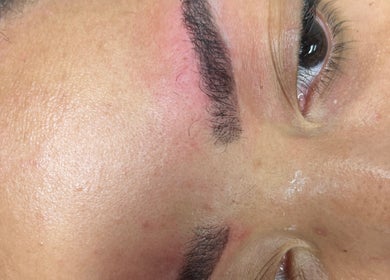 Eyebrow close-up showcasing precise grooming at Glamour & Grace in Bedford, Ohio, US.