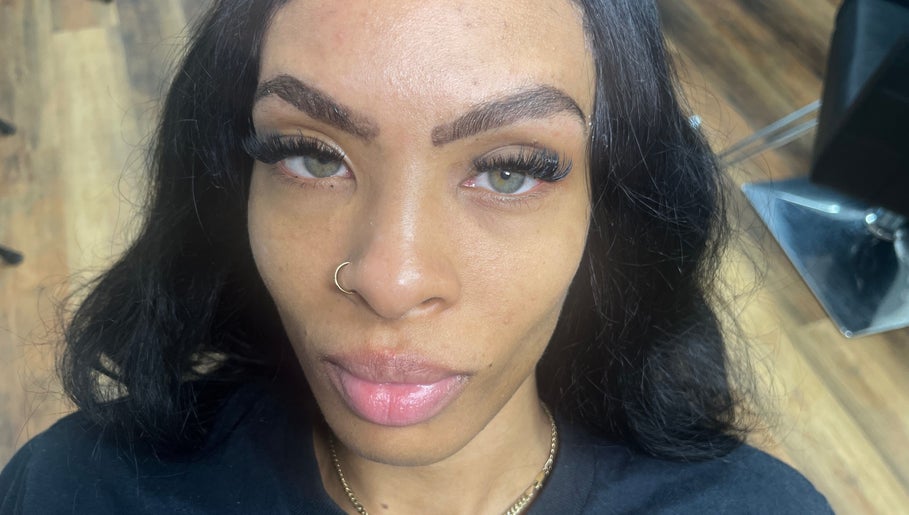 Close-up of a client's enhanced lashes at Obsessed Beauty Bar, Bedford, Ohio, US for a stunning look.