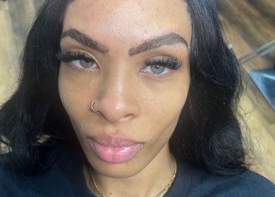 Close-up of a client's enhanced lashes at Obsessed Beauty Bar, Bedford, Ohio, US for a stunning look.