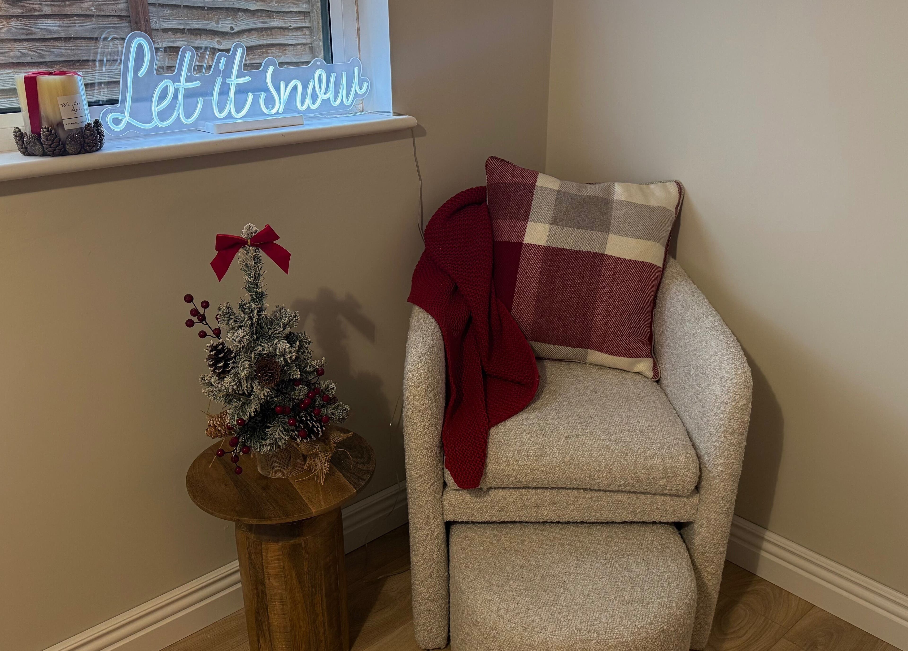 Cozy chair and festive decor at Skulpted by Harriet, Bognor Regis, England, GB.