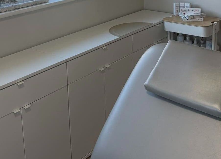 Modern treatment room at Skulpted by Harriet, Bognor Regis, England, GB, featuring a sleek table and minimal design.