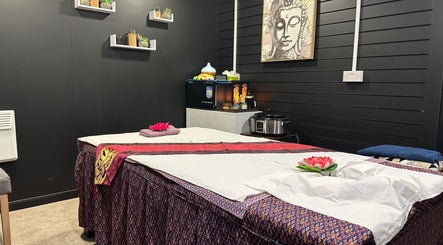 Tranquil massage room at Tien Hom Thai Massage and Spa, St Albans, England, GB with a calming Buddha decor.