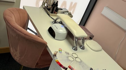 Nail’d it! cozy nail station in Yeovil, England, GB featuring a chair, UV lamp, and nail color palette.