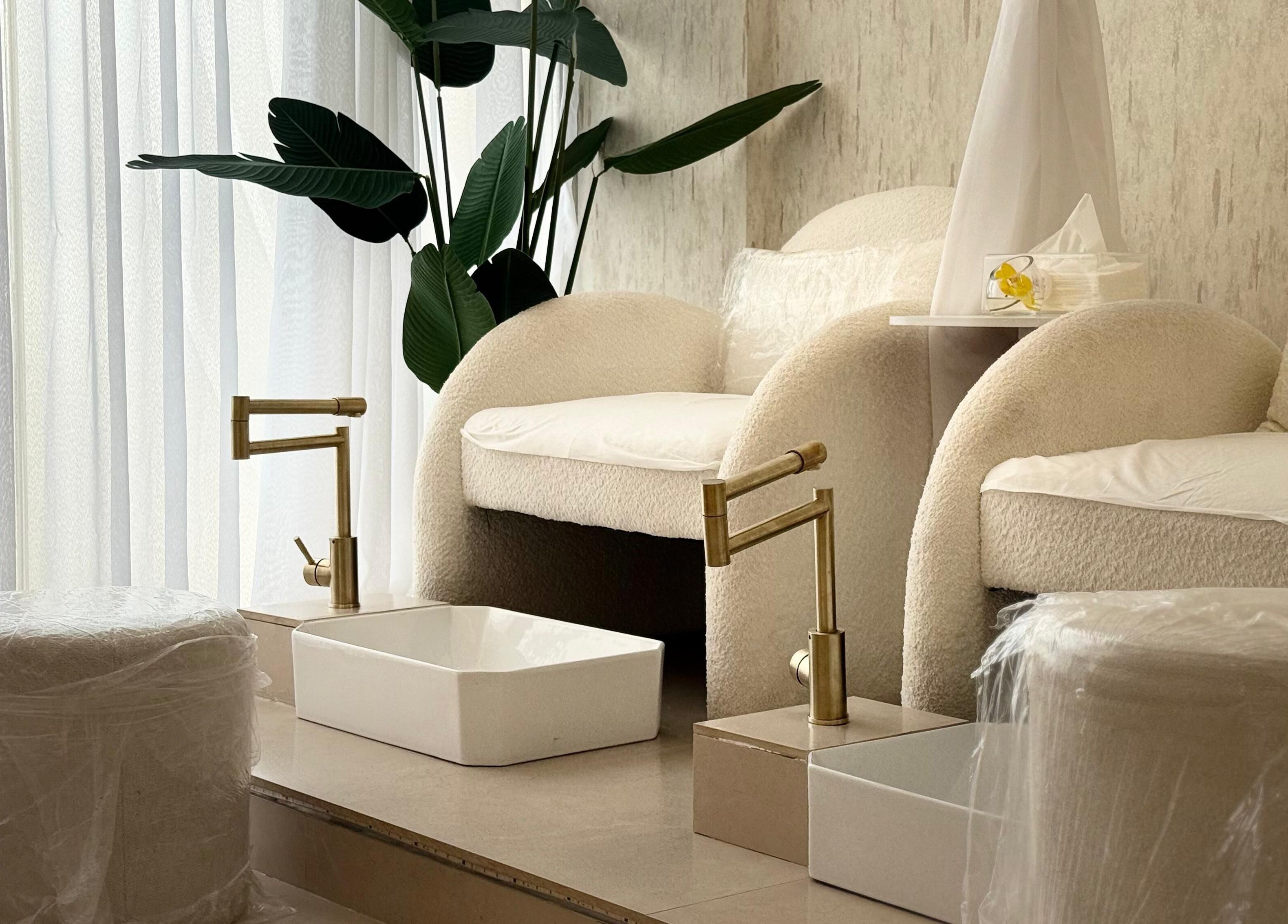 Luxurious pedicure area at H Beauty Ladies Salon, Ajman, Ajman, AE, featuring plush seating and modern decor.