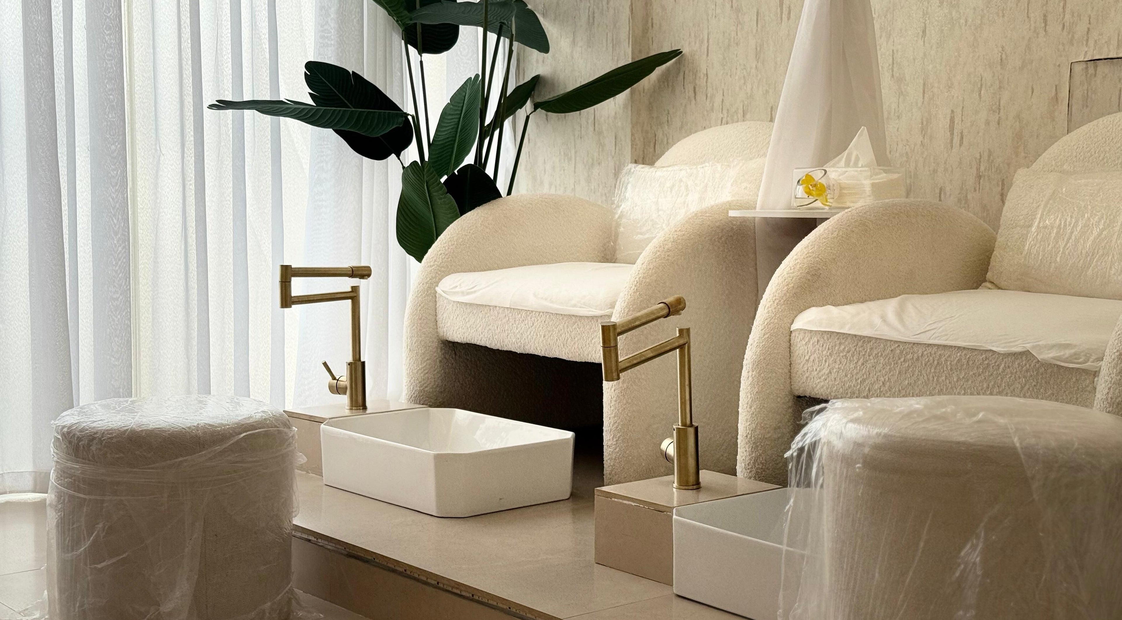 Luxurious pedicure area at H Beauty Ladies Salon, Ajman, Ajman, AE, featuring plush seating and modern decor.