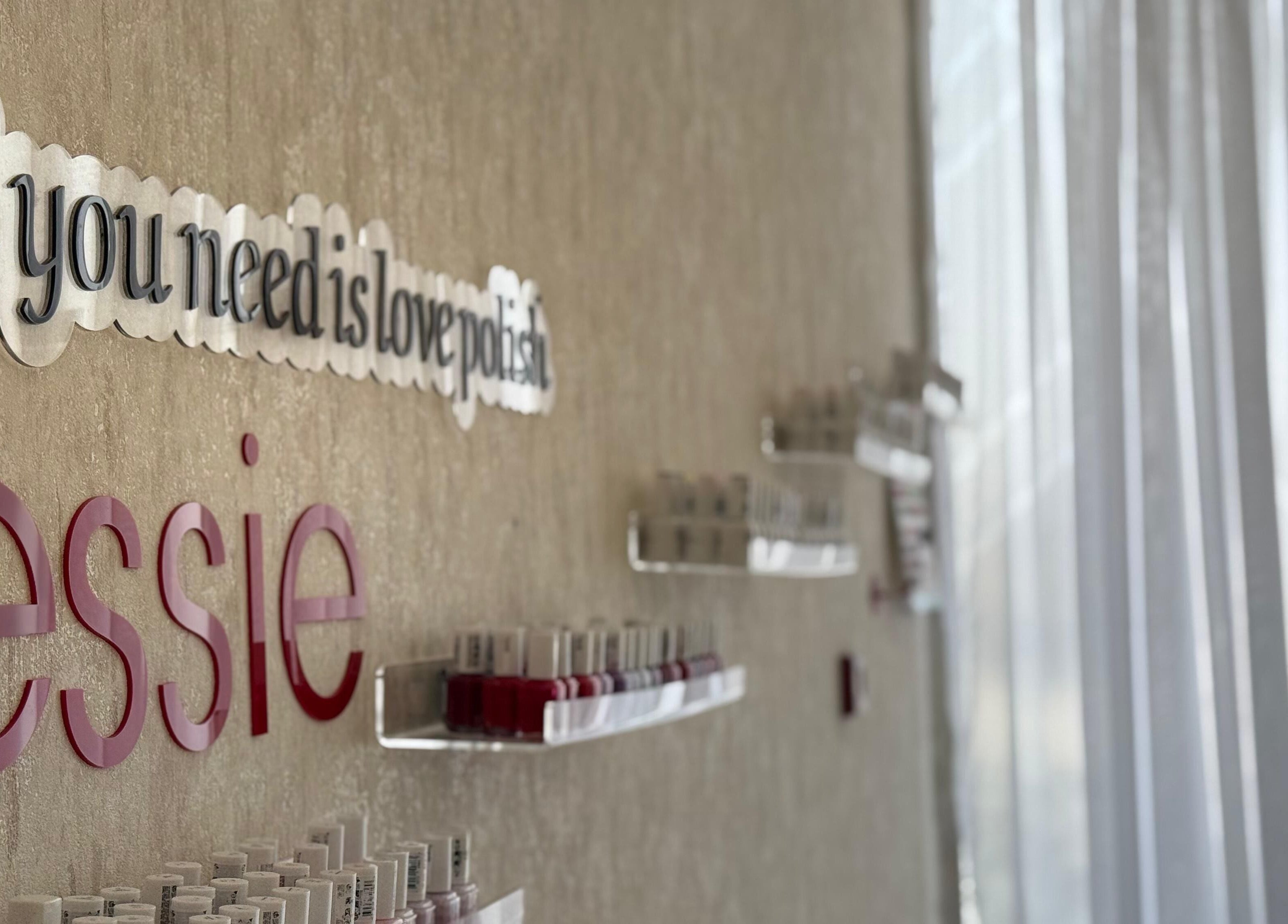 Nail polish display and wall art at H Beauty Ladies Salon in Ajman, Ajman, AE.