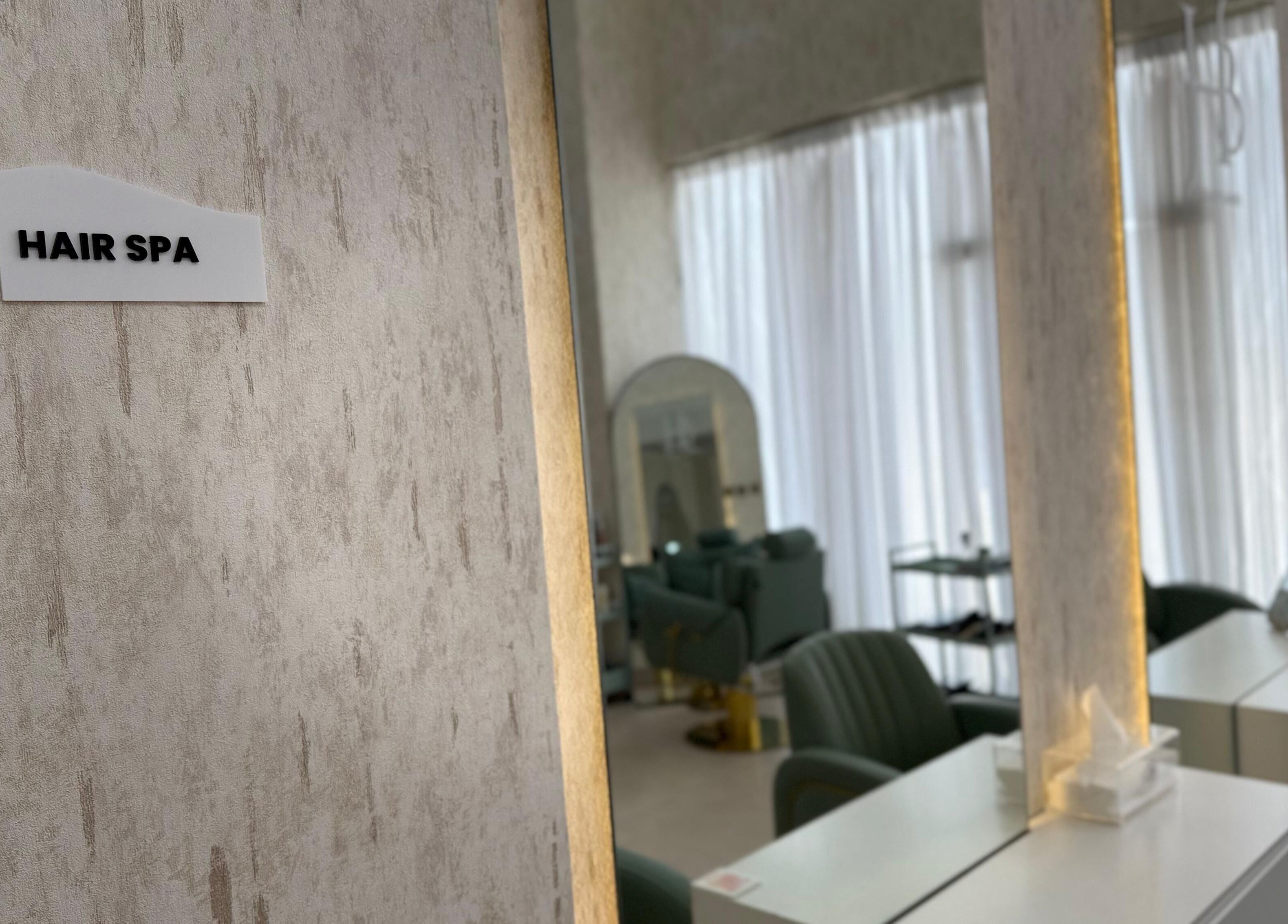 Elegant hair spa at H Beauty Ladies Salon in Ajman, Ajman, AE with modern decor and luxury seating.