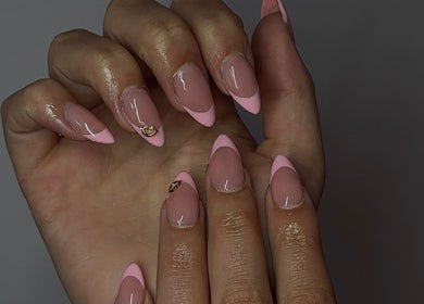 Elegant pink manicure by Nails by Mia in La Grande, Oregon, US showcasing intricate nail art design.