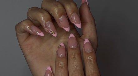 Elegant pink manicure by Nails by Mia in La Grande, Oregon, US showcasing intricate nail art design.
