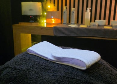 Relaxing spa setup at Charley_thedollshouse, Hessle, England. Soft towels and wellness products create a serene atmosphere.