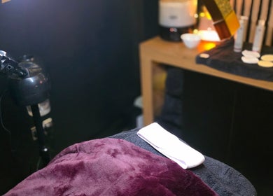 Relaxing spa room at Charley_thedollshouse, Hessle, England, GB with plush towels and skincare products.