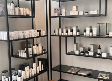 Shelf with beauty products at Lauren Taylor Beauty, Utrecht, Utrecht, NL. Minimalist and organized display.