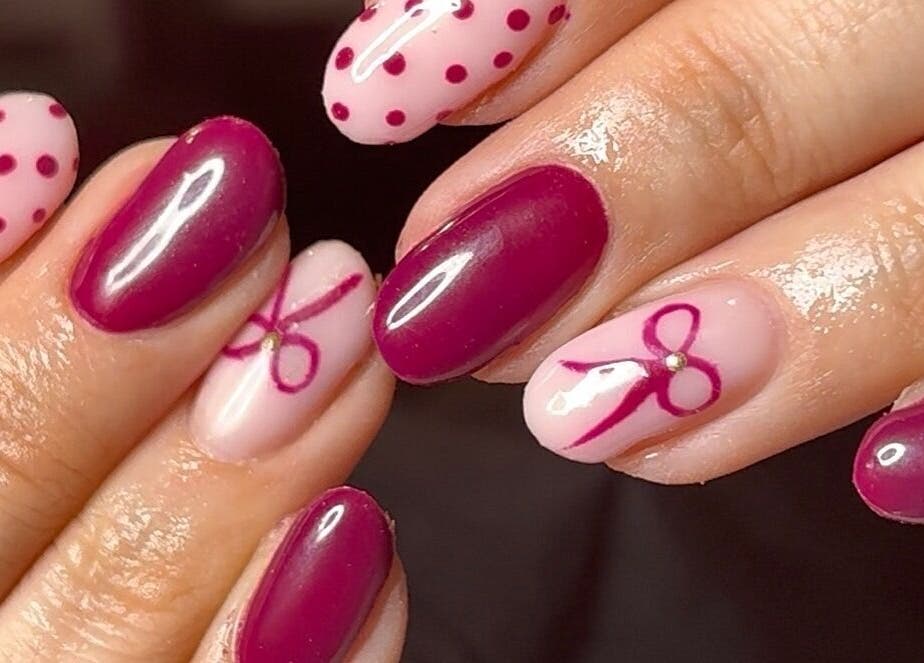Chic nail art with pink bows at Niche Nails, Ellesmere Port, England, GB.