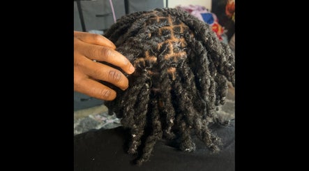 Intricate dreadlock styling at _styledbymarie444 in Hammond, Indiana, US showcasing texture and design.
