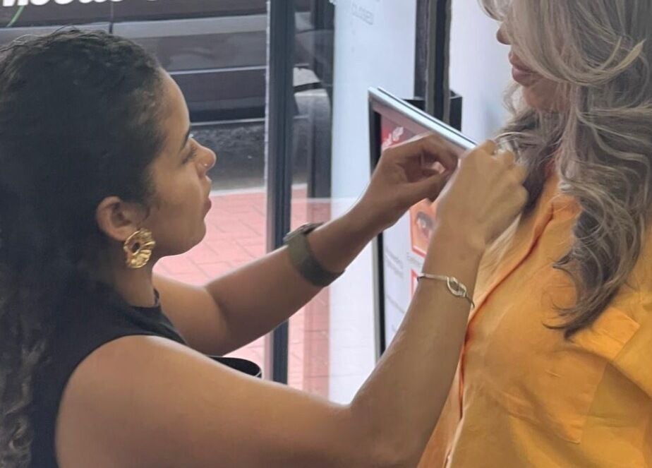 Stylist at Jessi Porphyrio hair in Smethwick, England, GB creating beautiful hairstyle.