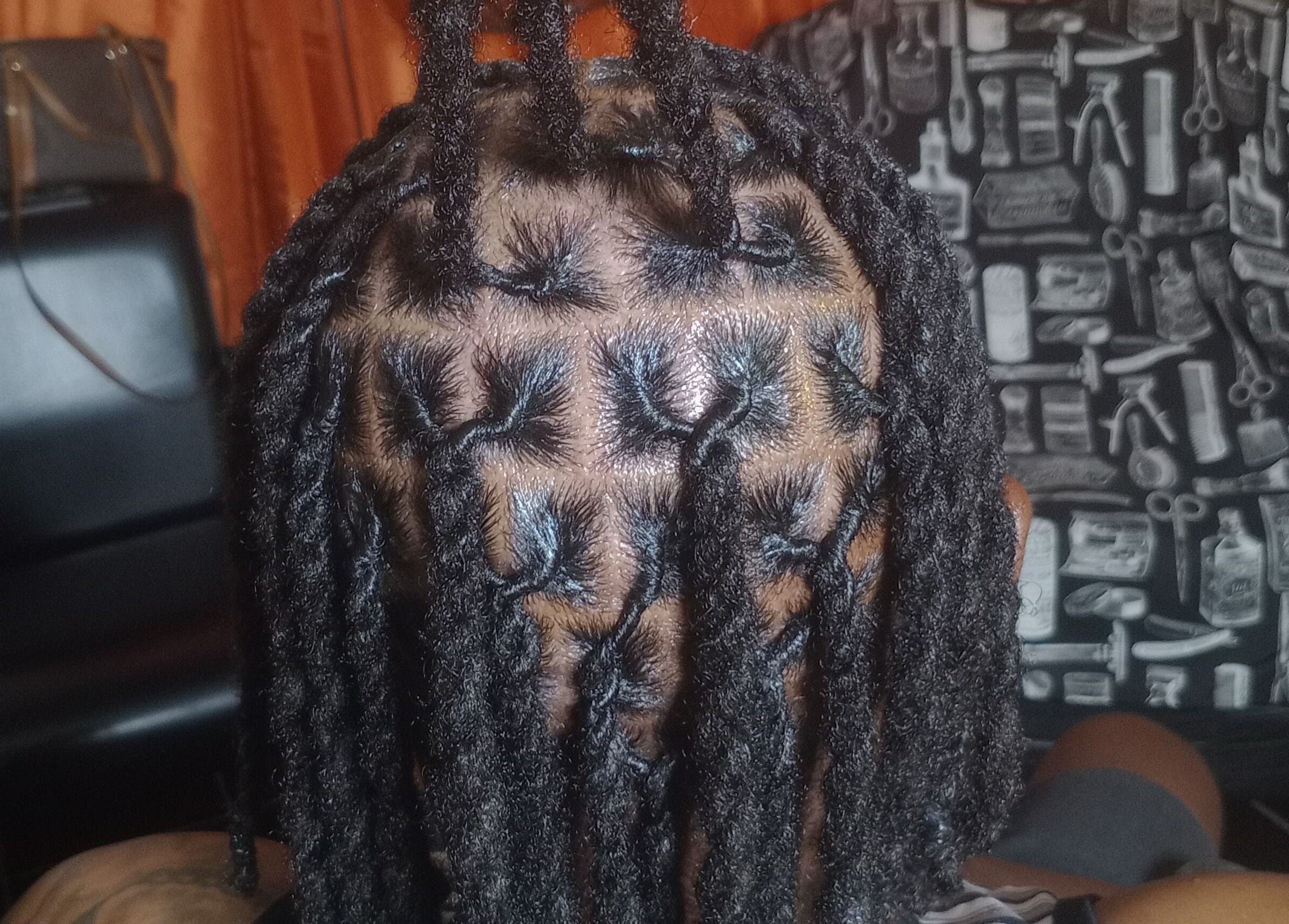 Intricate locs hairstyle at ManeTamed Locs, Nassau, New Providence, BS, showcasing expertly twisted hair.
