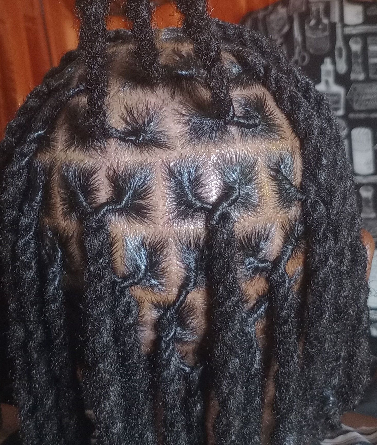 Intricate locs hairstyle at ManeTamed Locs, Nassau, New Providence, BS, showcasing expertly twisted hair.