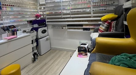 Cozy nail salon Glow in Style Nails in Singapore, SG, showcasing extensive polish collection and comfy chairs.