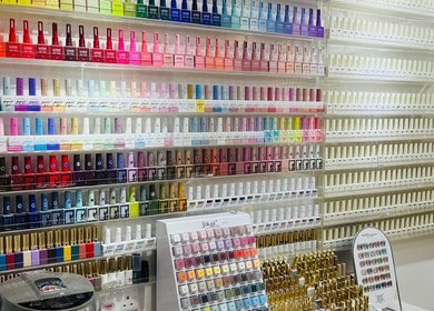 Vibrant nail polish display at Glow in Style Nails, Singapore, SG showcasing a wide color palette.