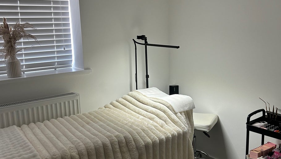Relaxing treatment room at Defined By Freya, Attleborough, England, GB with cozy bed and soft lighting.