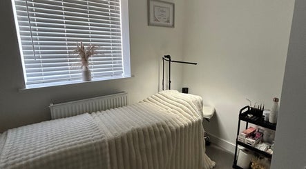 Tranquil therapy room at Defined By Freya, Attleborough, England, GB, showcasing a neatly made treatment bed.