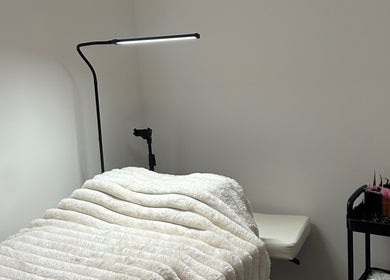 Relaxing treatment room at Defined By Freya, Attleborough, England, GB with a comfy bed and tools.